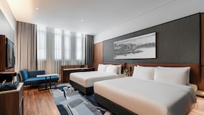 A modern hotel room with two beds, a desk, a sofa, and a large window with curtains. - Citadines Connect Bertam Georgetown Penang (George Town)