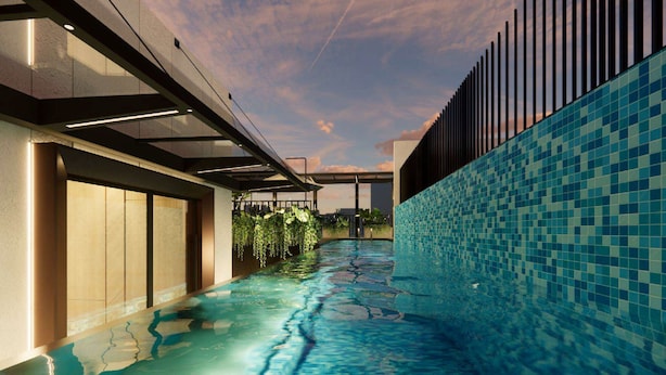 A modern indoor swimming pool with a glass ceiling, tiled walls, and a view of the sky. - Citadines Connect Bertam Georgetown Penang (George Town)
