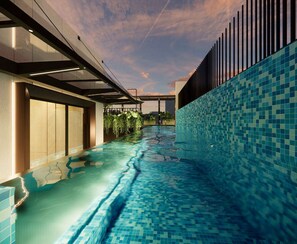 A modern indoor swimming pool with a glass ceiling, tiled walls, and a view of the sky. - Citadines Connect Bertam Georgetown Penang (George Town)