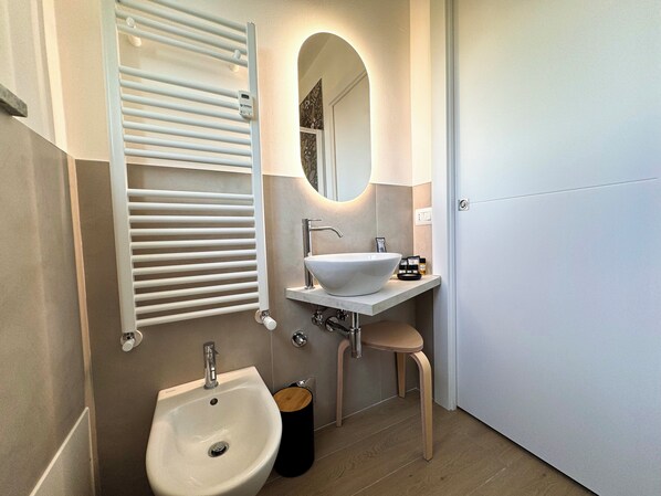 Hair dryer, bidet, towels, soap