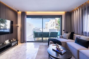 Luxury Apartment, City View | Living area | 65-inch Smart TV with satellite channels, Netflix, streaming services