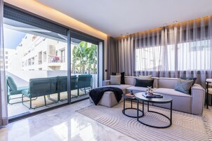 Luxury Apartment, City View | Living area | 65-inch Smart TV with satellite channels, Netflix, streaming services