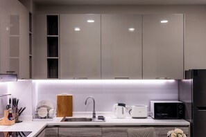 Superior Apartment, 2 Bedrooms, Balcony | Private kitchen | Full-size fridge, microwave, stovetop, cookware/dishes/utensils