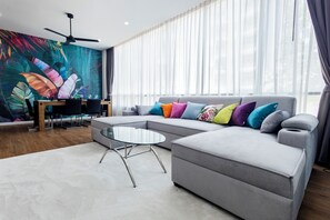 Standard Apartment, 1 Bedroom, Balcony, Garden View | Living area | 55-inch Smart TV with digital channels