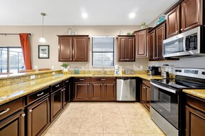 Fridge, microwave, oven, stovetop - ChampionsGate Resort: Game Room w/ Pool Near Disney (Davenport)