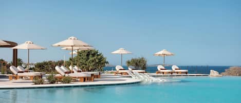 Indoor pool, seasonal outdoor pool, pool umbrellas, sun loungers
