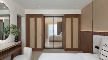 A modern bedroom with a large bed, a bedside table with a mirror, a chair, and a wardrobe with a sliding door.