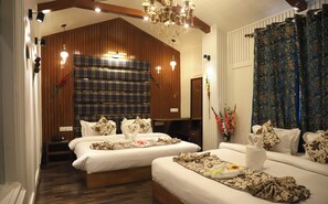 A hotel room with two beds, wooden paneling, a chandelier, and a large mirror. - The Hoften Al Shaykh Resorts, Srinagar (Srinagar)