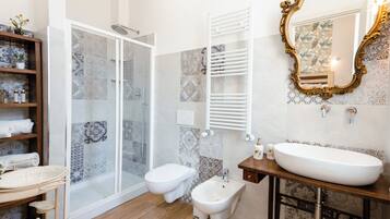 Shower, hair dryer, bathrobes, towels