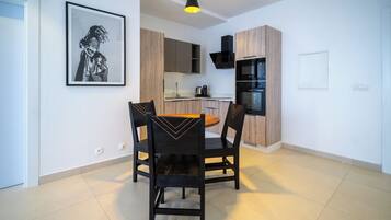 Standard Suite | Living area | 100-cm flat-screen TV with premium channels