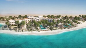 A beachfront resort with multiple buildings, a swimming pool, and a beach area. - Hawar Resort By Mantis (Hawar)