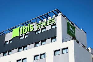 A modern building with the "ibis Styles" sign on the facade.