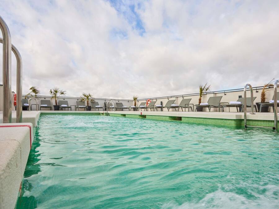 Seasonal outdoor pool, open 11:00 AM to 9:00 PM, sun loungers