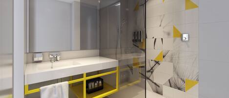 A modern bathroom with a glass shower enclosure, a white sink, and a yellow storage unit.