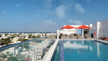 2 outdoor pools, open 7:00 AM to 7:00 PM, pool umbrellas, pool loungers