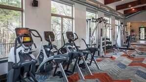 A gym with treadmills, ellipticals, and weight machines. - Boulevard Stays Direct Trail Access! Parking, Pool, Gym 04 (RICHARDSON)