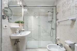 Shower, hair dryer, towels, toilet paper