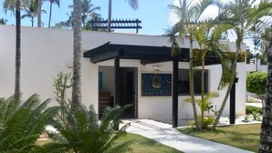 A building with a sign for 'EPOS Beauty & Spa'. - Peaceful villa with garden and swimming pool - 300 m from the beach (Las Terrenas)