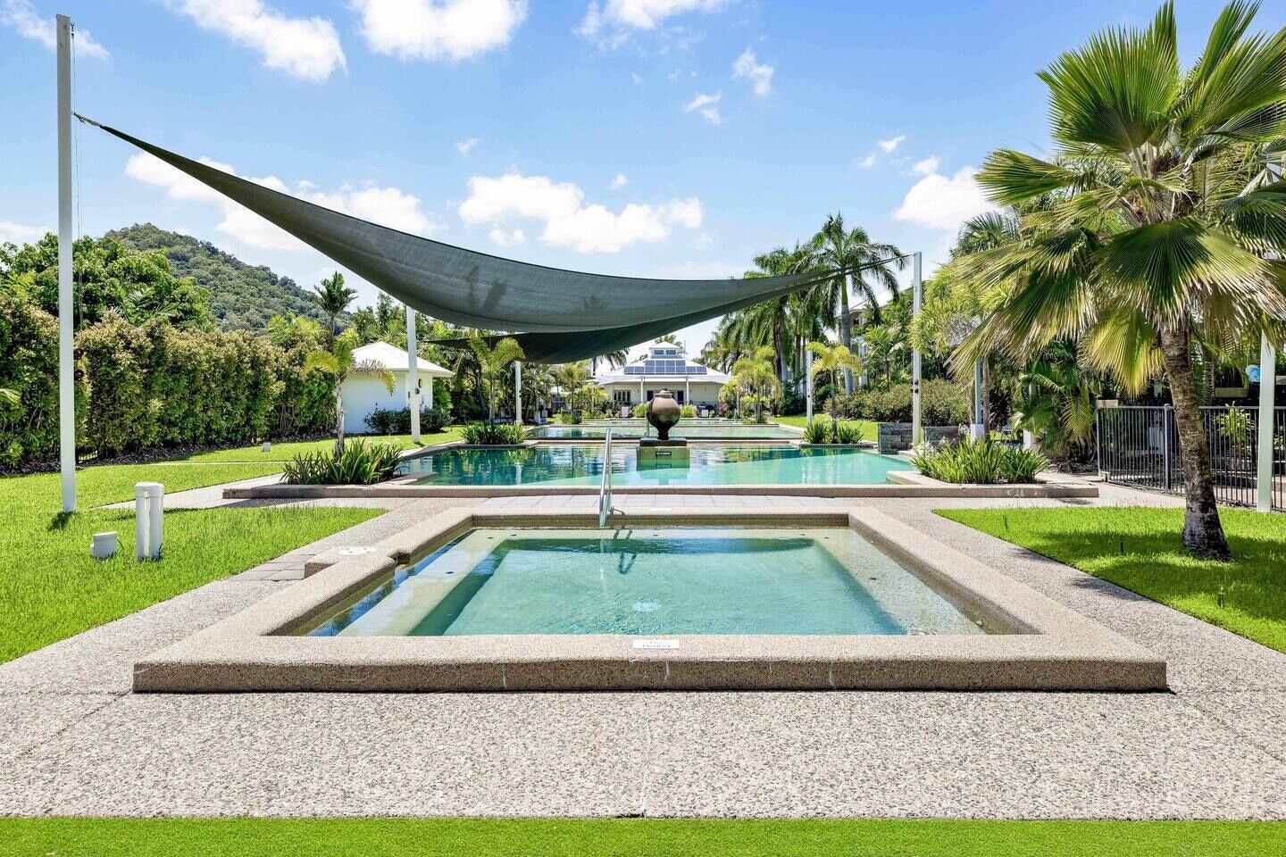 Take advantage of the shared sparkling pools, surrounded by tropical palm trees.