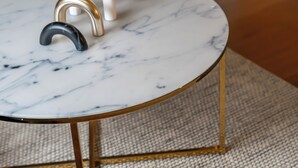 A round table with a marble top and gold legs. - 1-Bedroom City Sophistication: Unwind in Style! (London)