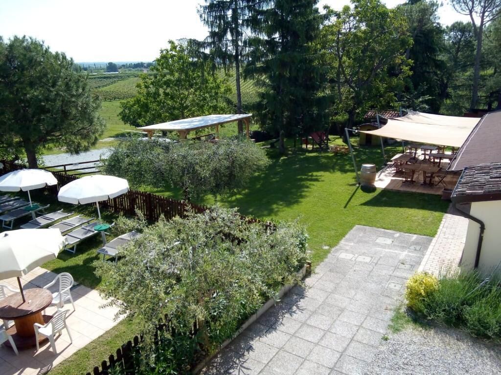 A patio area with outdoor seating and a view of the surrounding landscape.