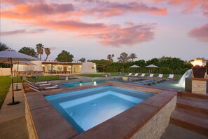 A resort with multiple swimming pools, lounge chairs, and umbrellas. - Starlight Estate by Avantstay 20 People Architectual Mansion w Pool Tennis Court Game Room (Indio)