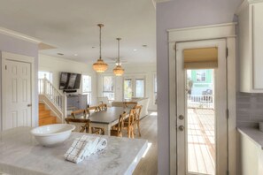 Enjoy a meal in the kitchen with a dining table and chairs, or take in the view from the balcony.