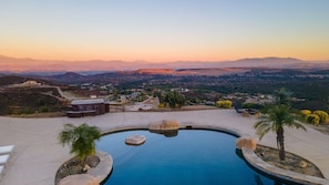 A swimming pool with a view of a city and mountains in the background. - Colina by Avantstay Secluded Mountain Top Oasis w Pool Hot Tub Putting Green (Murrieta)