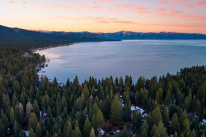 A lake surrounded by dense forest and mountains. - Lundy Bearden Serene Tahoe Retreat With Deck Fireplace and Forest Views (Carnelian Bay)