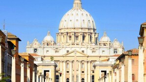 A large historical building with a prominent dome and classical architecture.