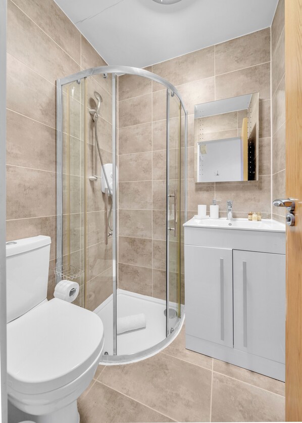 Shower, hair dryer, towels, soap