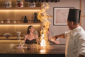 Savor the art of traditional cuisine in our restaurant, where chefs expertly prepare dishes with a dramatic flair.