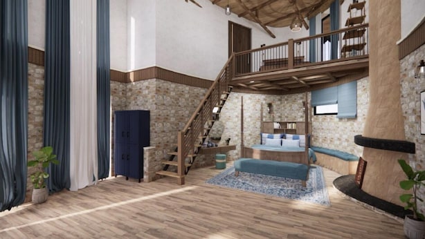 Un vaste espace de vie doté d’un escalier en bois, d’un lit intégré et d’un balcon.