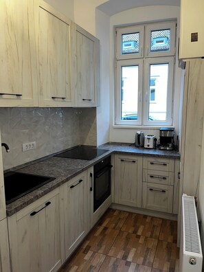 Superior-Apartment | Wohnbereich | Flachbildfernseher