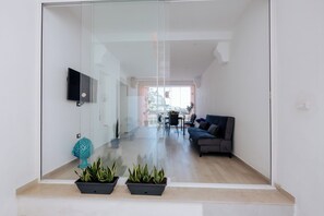 Deluxe Apartment | Living area | 42-inch flat-screen TV with digital channels - Maison Lorelle (Sorrento)