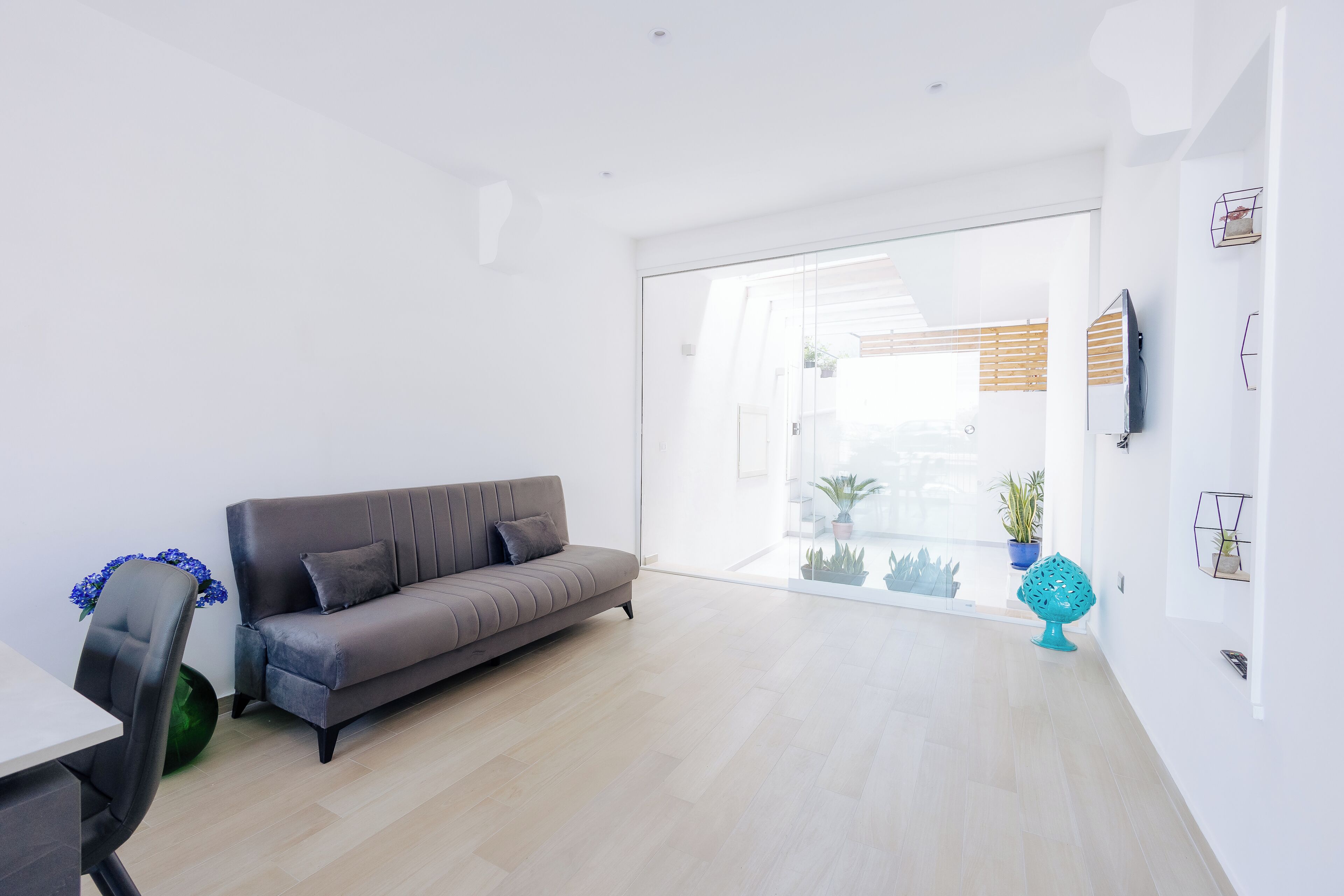 Deluxe Apartment | Living area | 42-inch flat-screen TV with digital channels