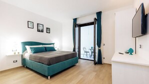 Apartemen Deluks | 2 kamar tidur, tirai kedap cahaya, dan setrika/meja setrika