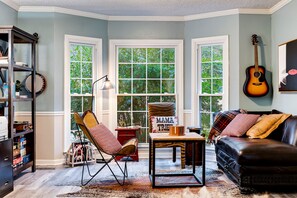 Smart TV, fireplace, books, computer monitors