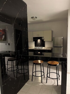 Fridge, microwave, stovetop, coffee/tea maker