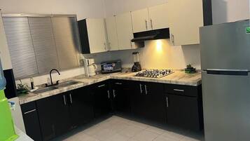 Fridge, microwave, stovetop, coffee/tea maker