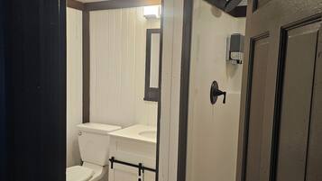 Shower, towels, soap, toilet paper