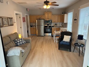 A compact living space with a kitchenette, a dining area, and a seating area. - 1 BR Apt - Walk to Historic Hub (St. Augustine)