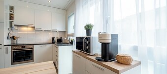 Serene Swiss Apt | scenic balcony views + parking + hi-speed wifi 