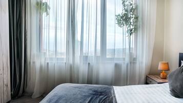 2 habitaciones, tabla de planchar con plancha, wifi y ropa de cama