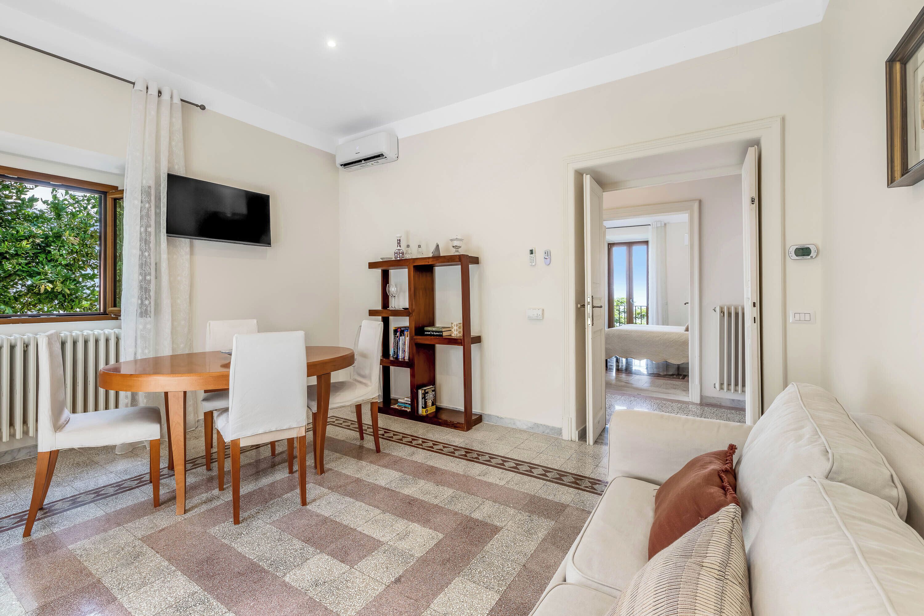 Superior Suite, Lake View | Living room | 42-inch flat-screen TV with digital channels