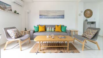 Family Apartment, City View | Living area | TV