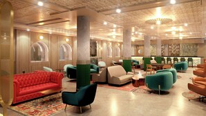 Un área de estar moderna con asientos cómodos, un bar y un techo decorativo.