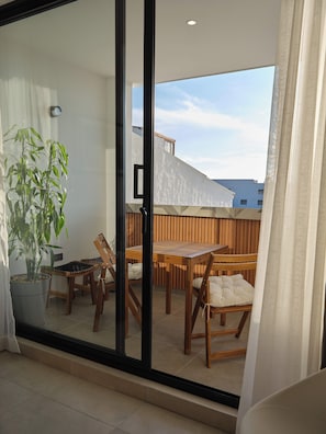 Comfort Apartment, Balcony, Hill View | Living area | Flat-screen TV