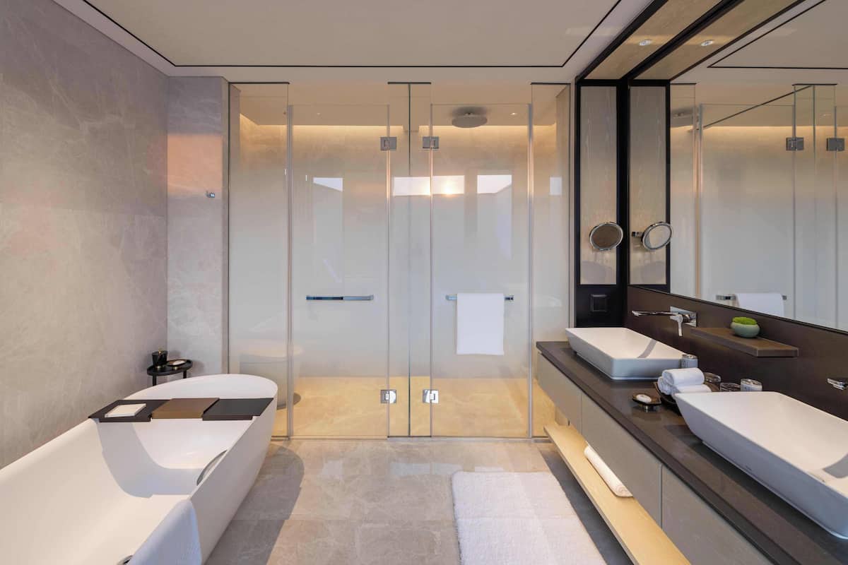 Separate tub and shower, rainfall showerhead, hair dryer, bathrobes