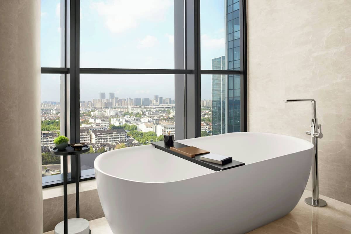 Separate tub and shower, rainfall showerhead, hair dryer, bathrobes